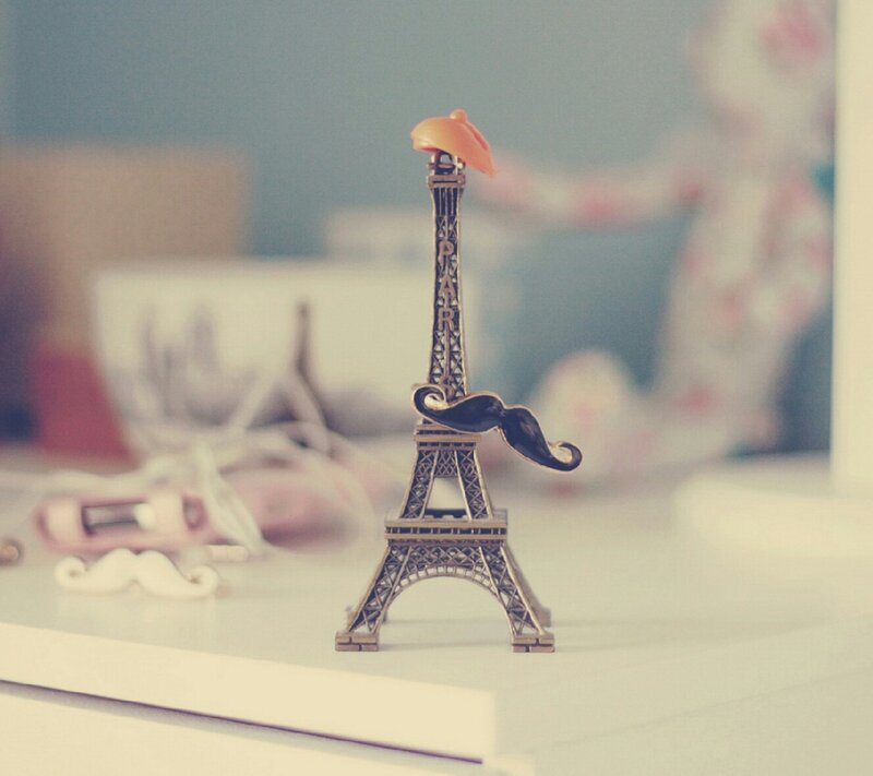 Eiffel Tower Figurine — White, Calm, Photograph, Mustache
