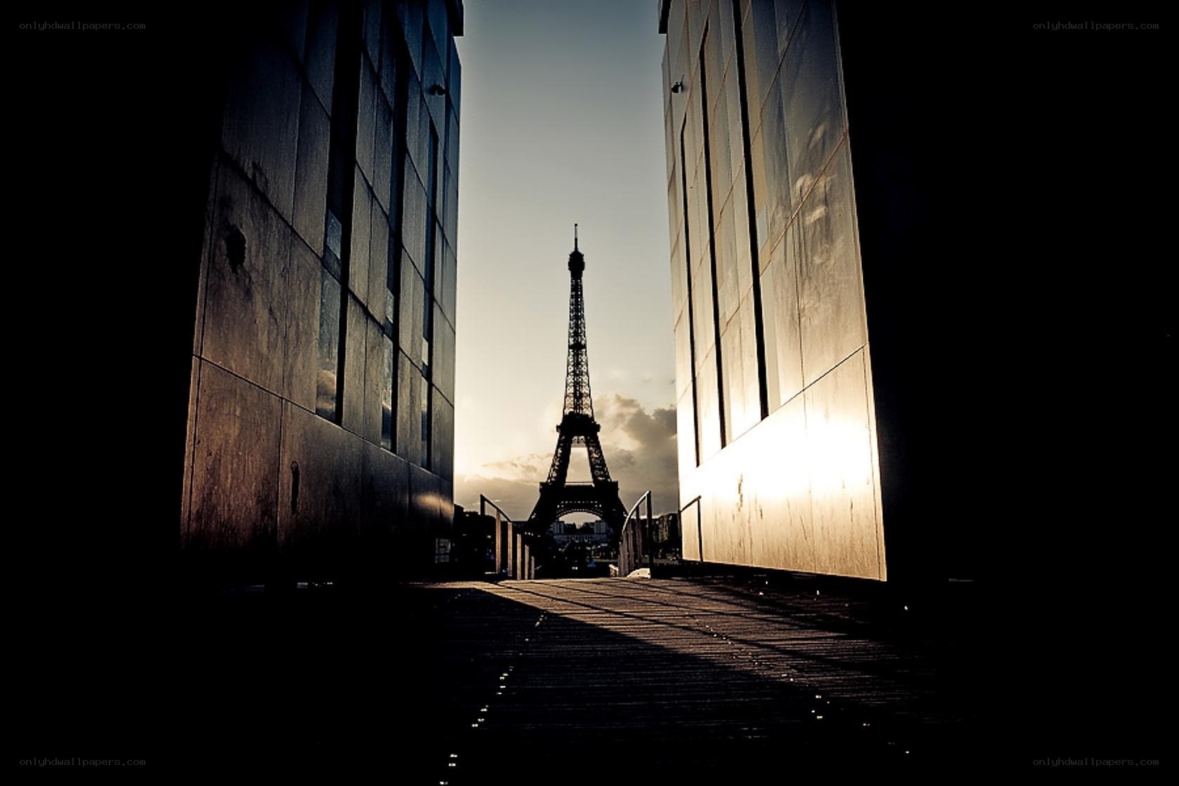 Eiffel Tower framed by buildings