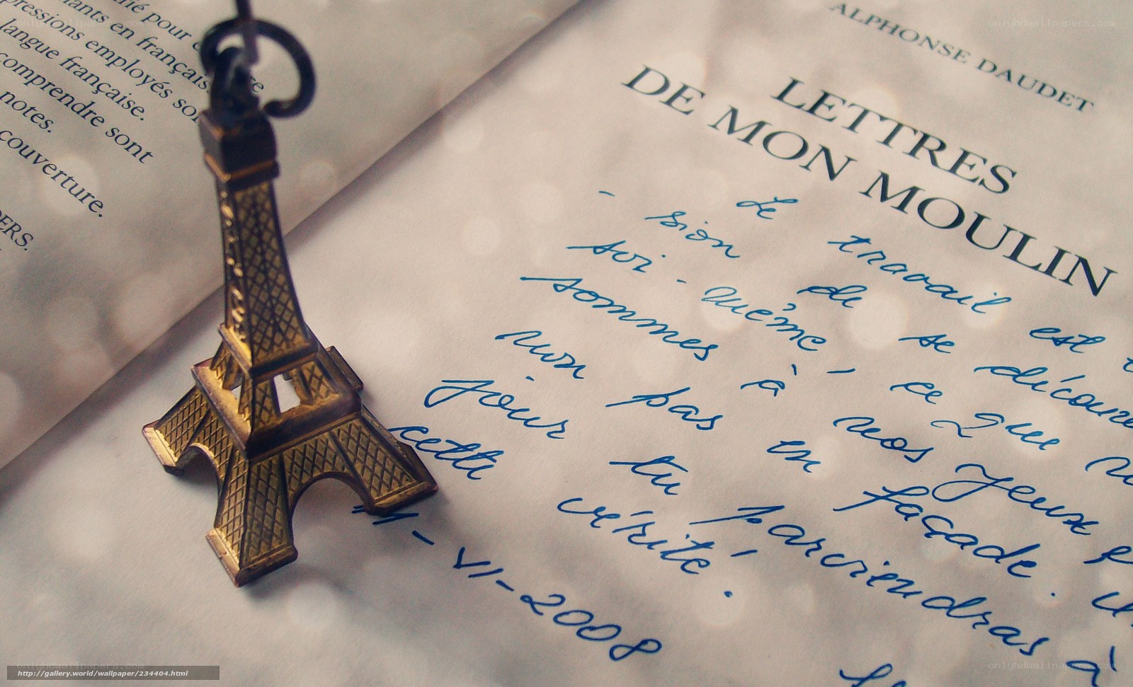 Eiffel Tower keychain on book