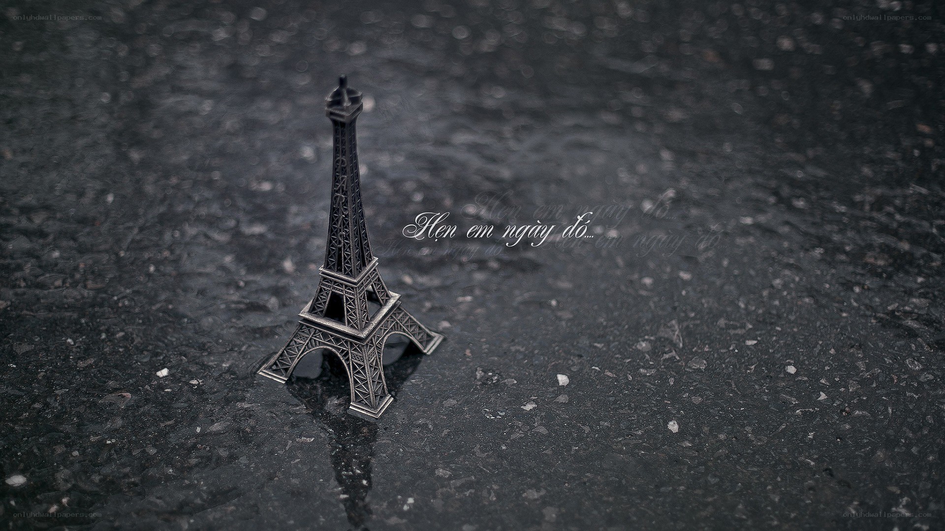 Eiffel Tower model on wet pavement