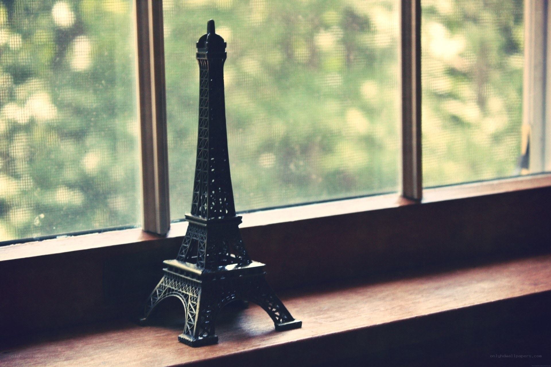 Eiffel Tower model on windowsill