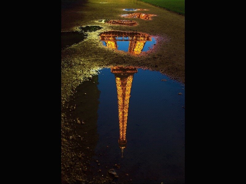 Eiffel Tower reflection in puddle