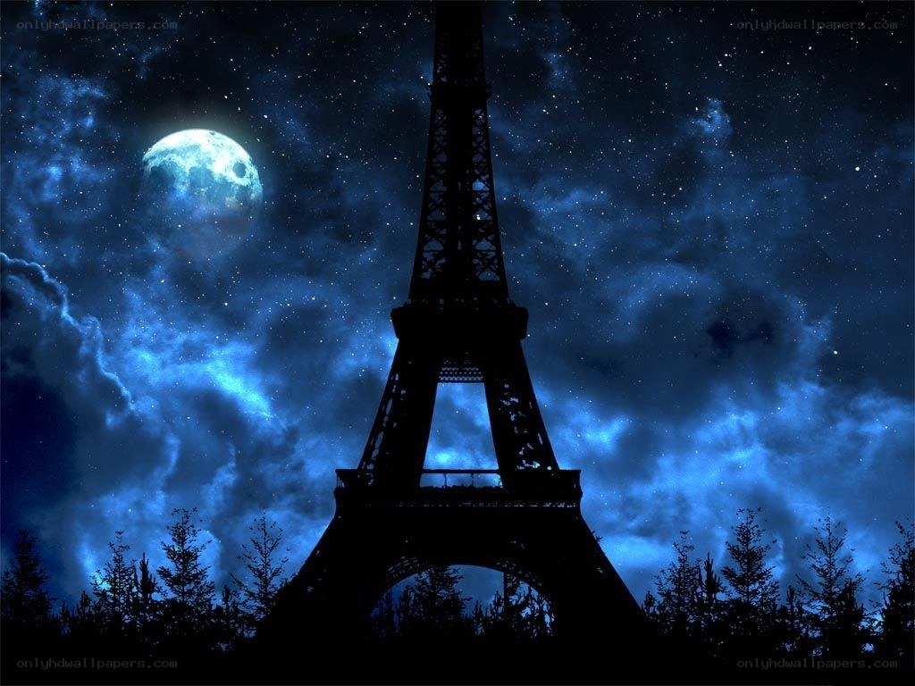 Eiffel Tower under moonlit sky