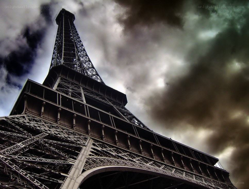 Eiffel Tower under stormy sky