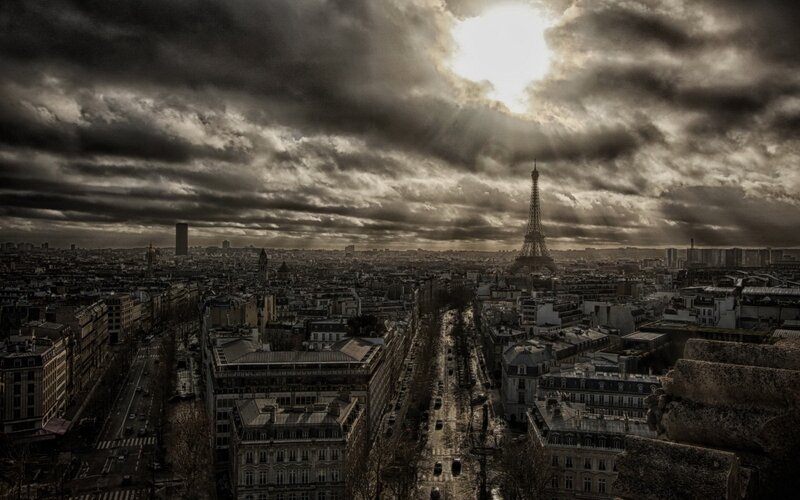 Eiffel Tower under stormy sky