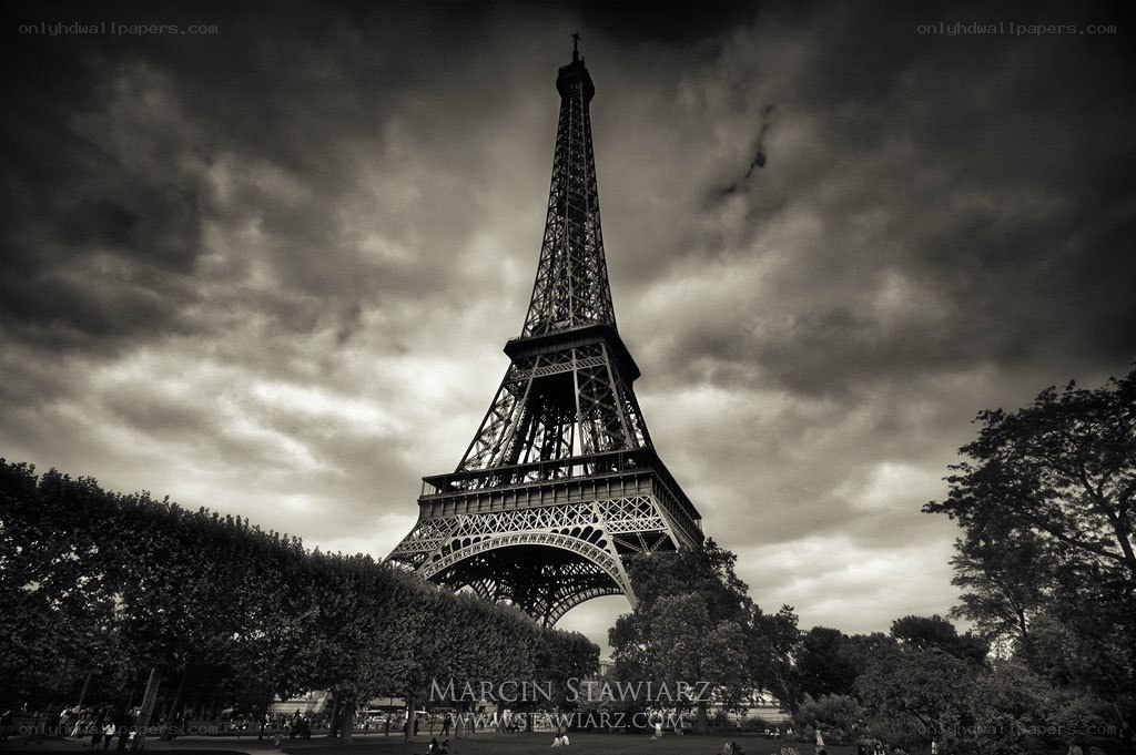 Eiffel Tower under stormy sky