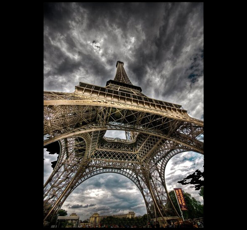 Eiffel Tower under stormy sky