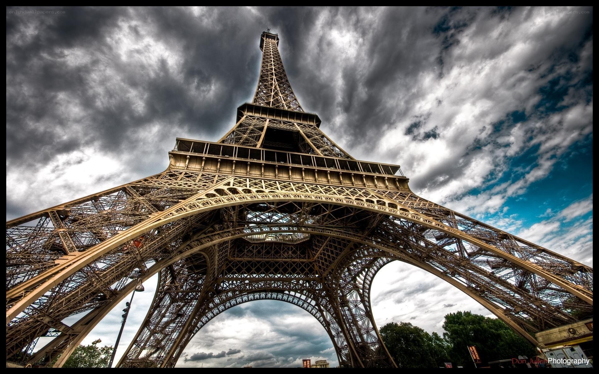 Eiffel Tower under stormy sky