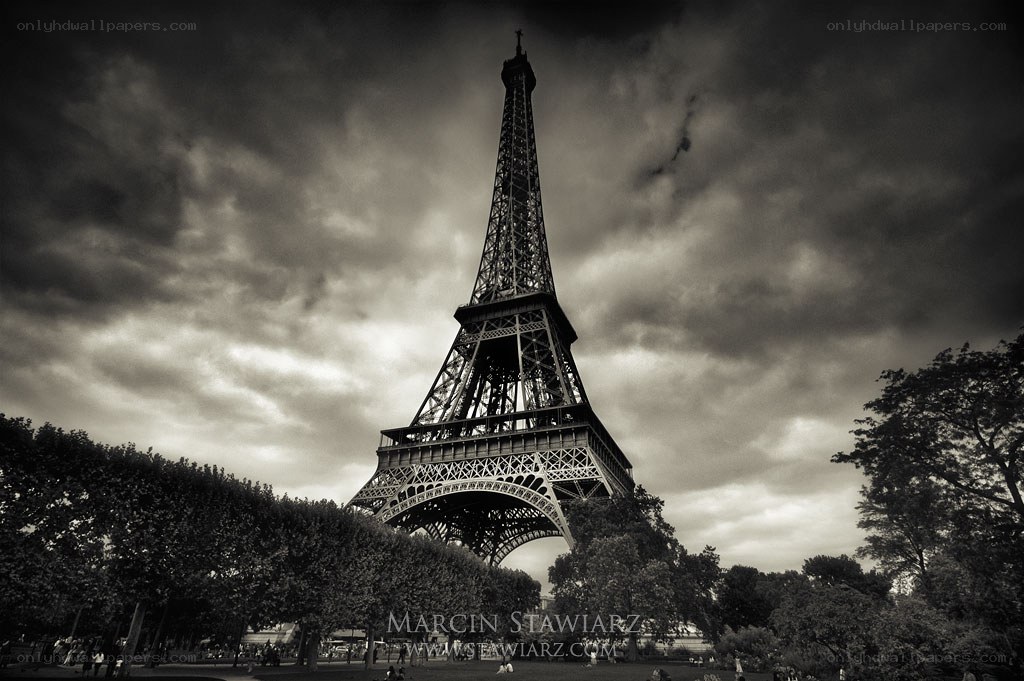 Eiffel Tower under stormy sky