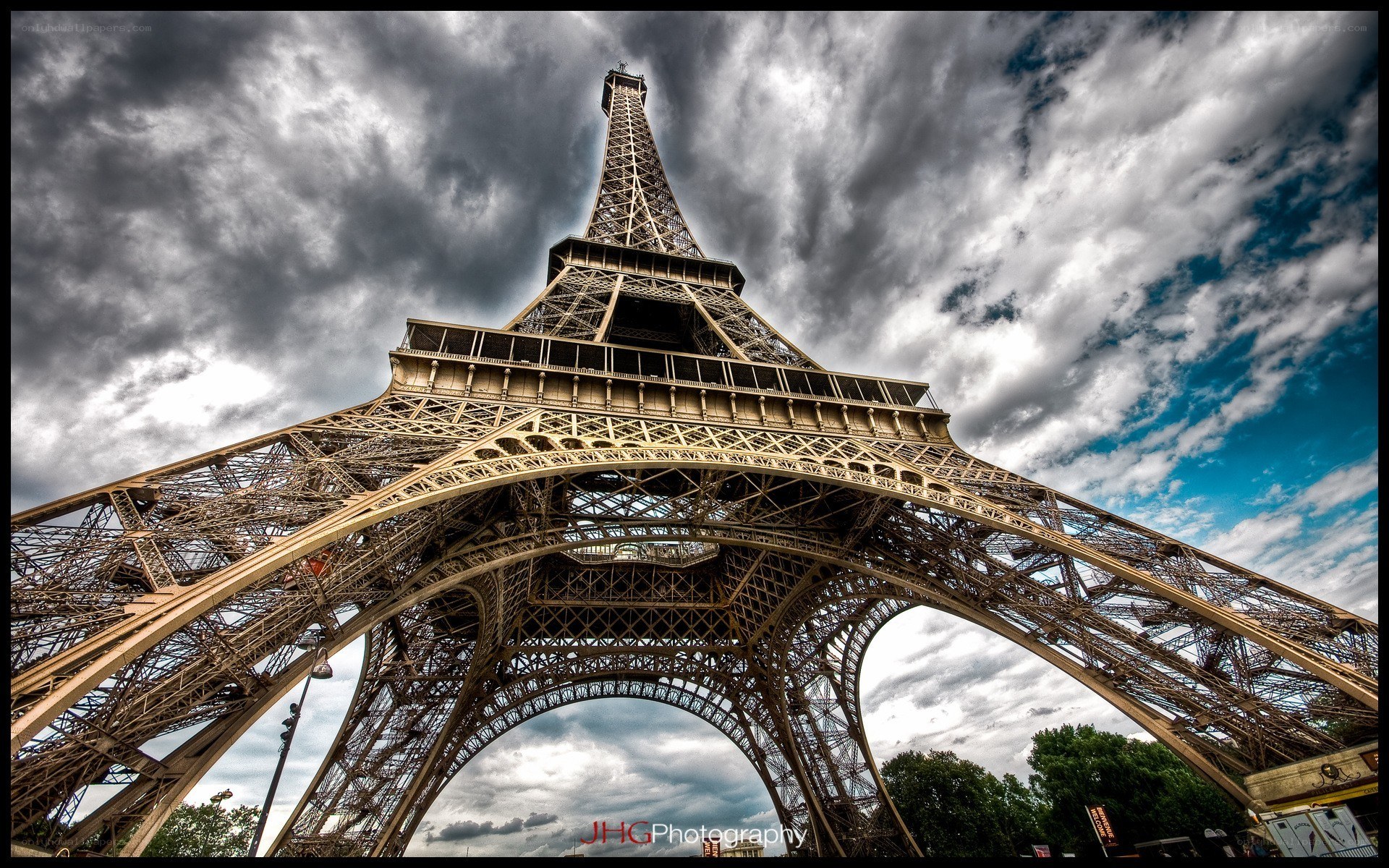 Eiffel Tower under stormy sky