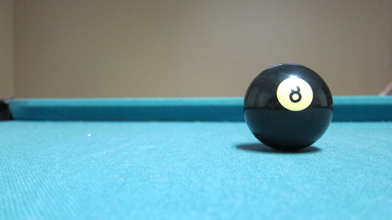 Eight ball on pool table