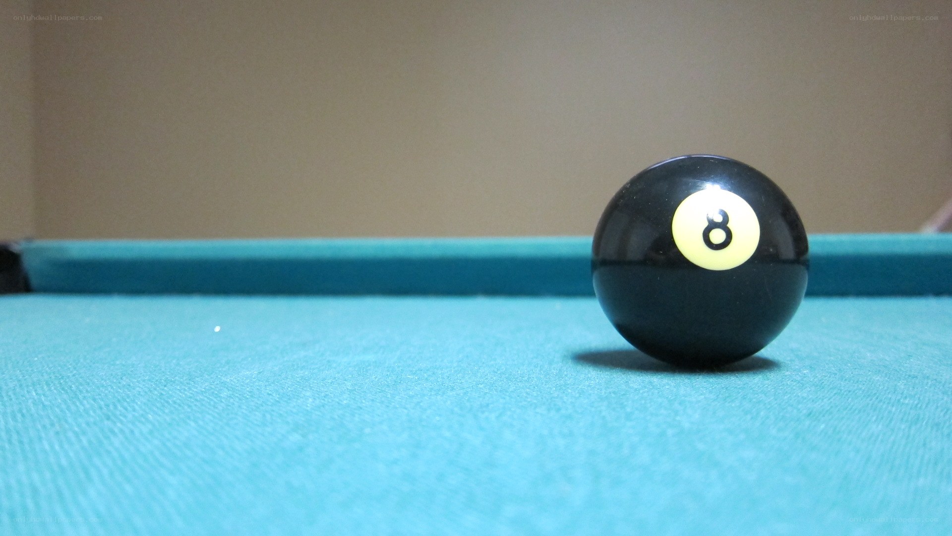 Eight ball on pool table