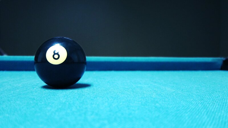 Eight ball on pool table