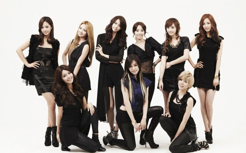 Eight Women in Black Outfits — Confident, Photograph