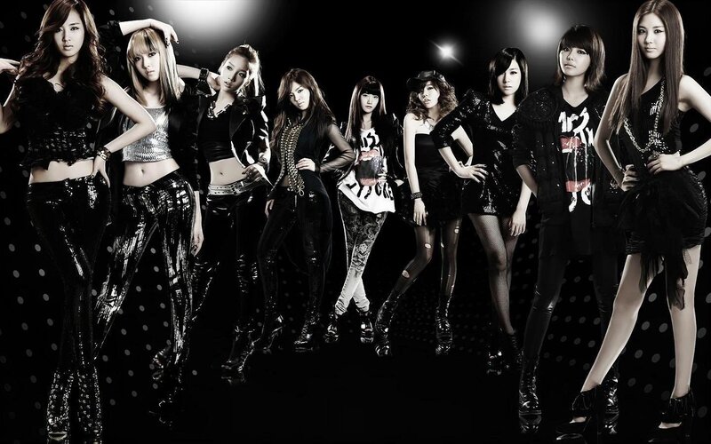 Eight Women in Black Outfits