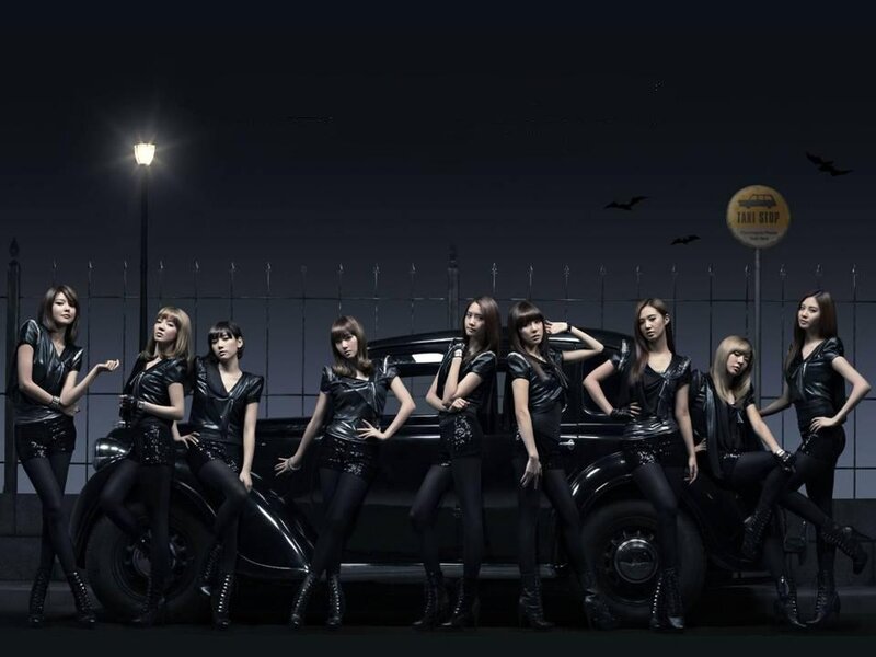 Eight Women Posing with Car