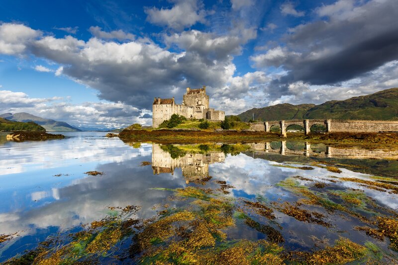 Eilean Donan Castle — Blue, Dramatic, Afternoon, Photograph, Bridge, Mountains