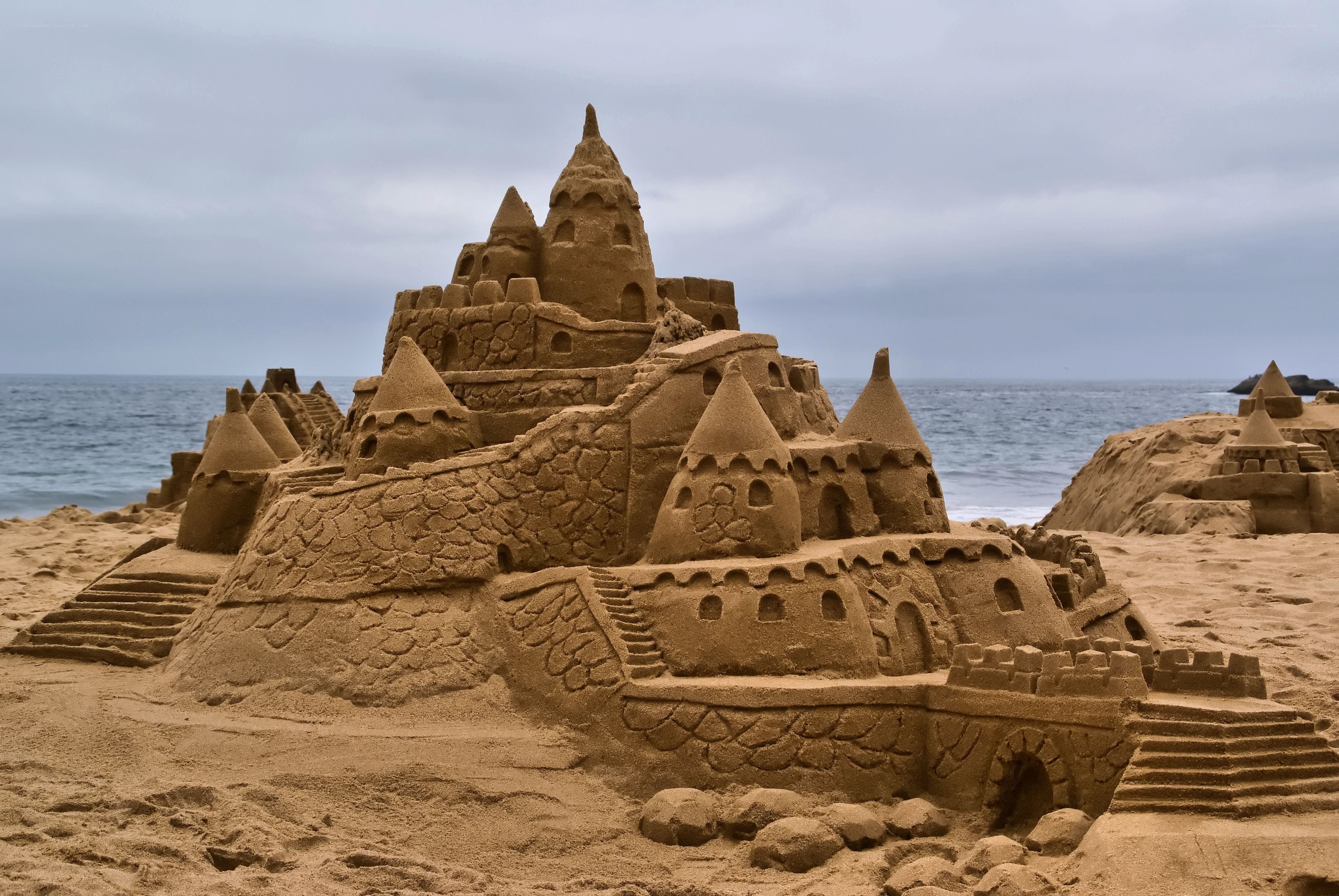 elaborate sandcastle on beach