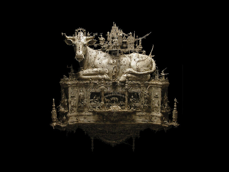 Elaborate silver sculpture of a cow