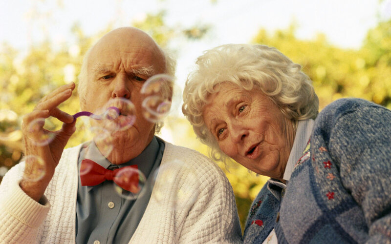 Elderly Couple Blowing Bubbles