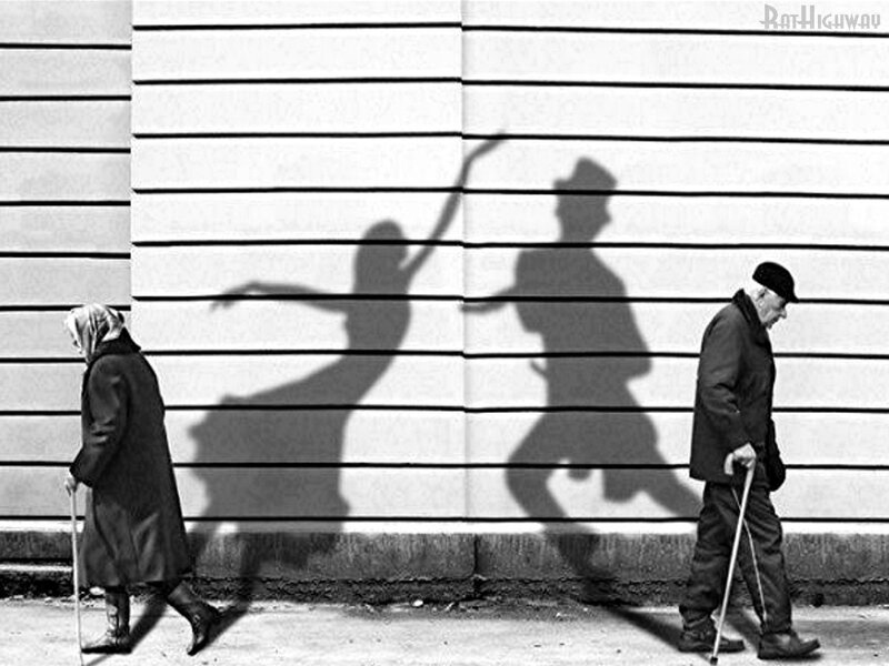 Elderly couple casting shadows