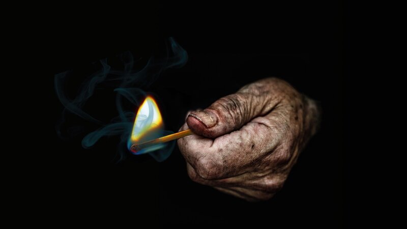 Elderly Hand Holding Match