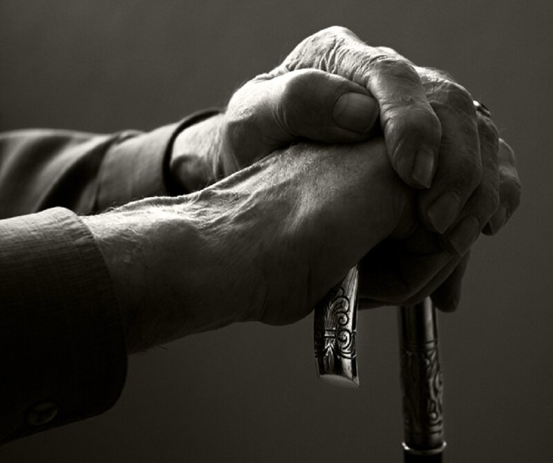 Elderly Hands Holding Cane