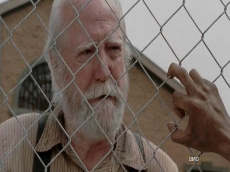 Elderly Man Behind Fence