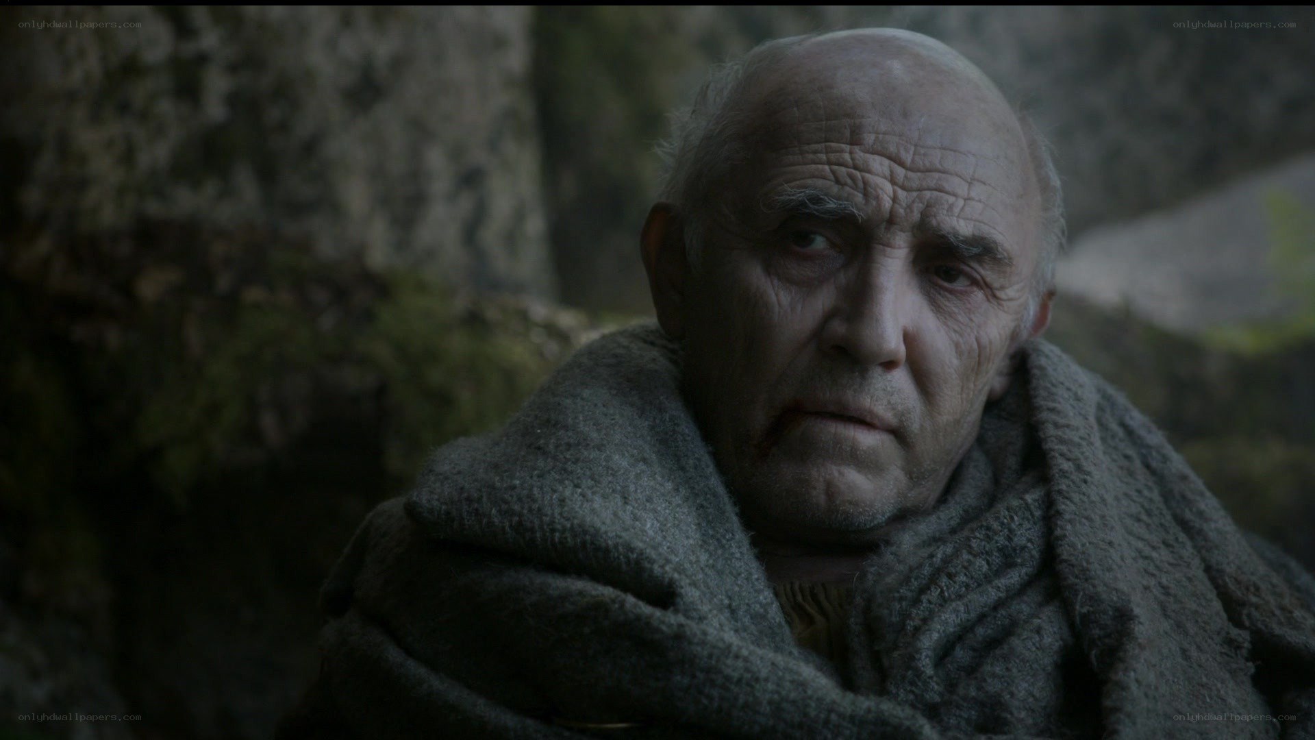 elderly man in cloak
