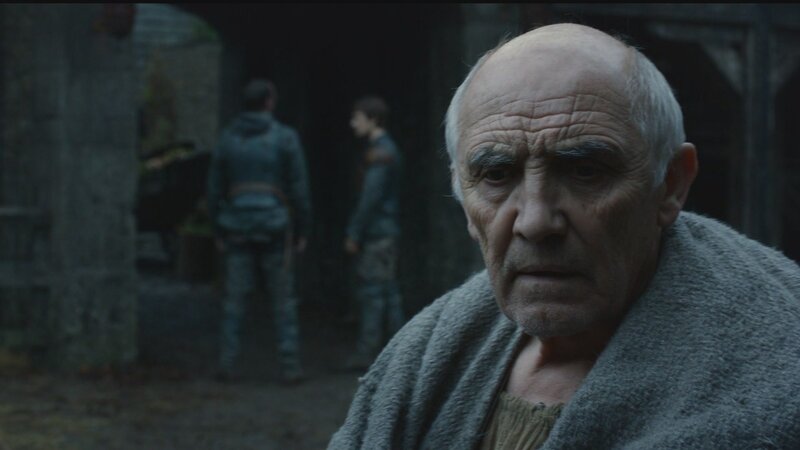 elderly man in dim alley
