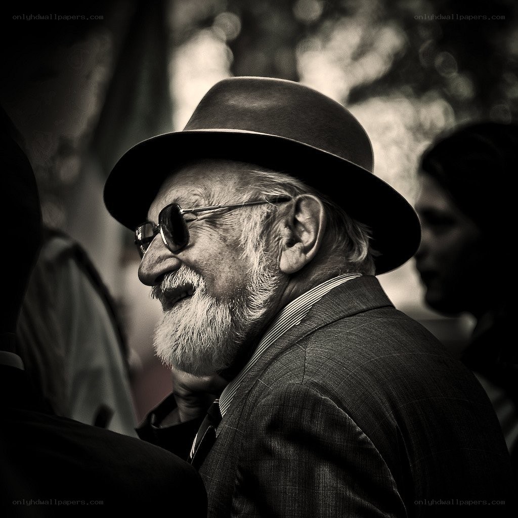 elderly man in hat and sunglasses