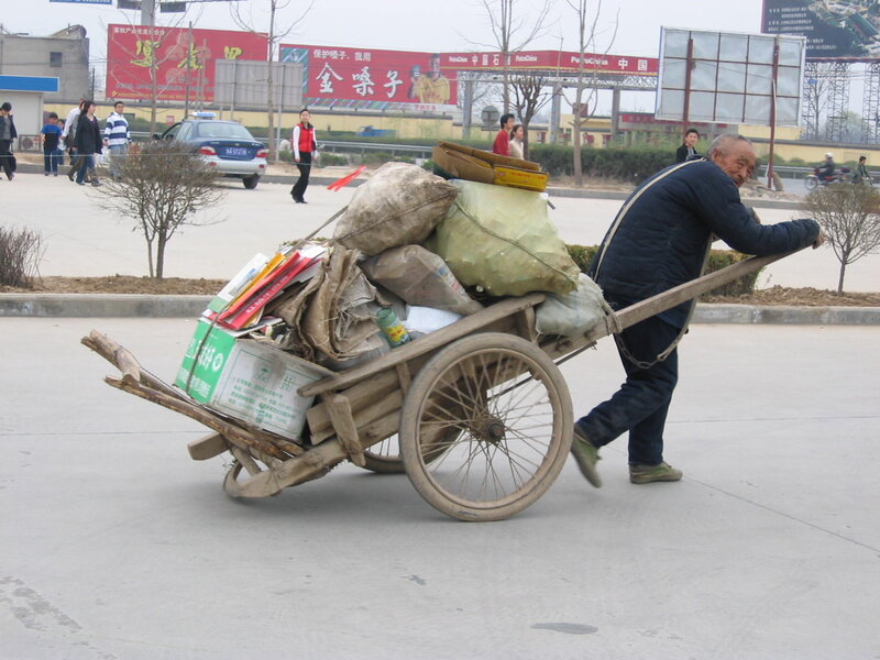 Elderly Man Pushing Cart