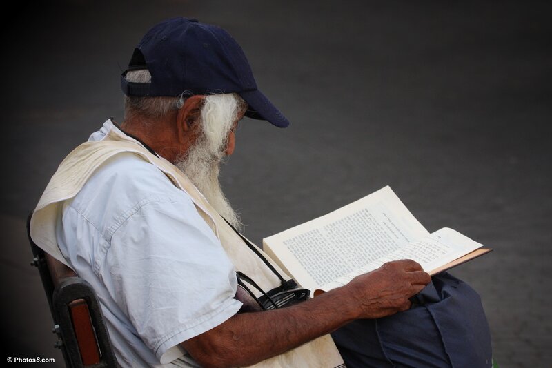 Elderly Man Reading Book — Blue