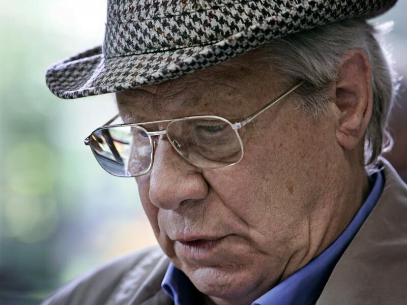 Elderly Man Wearing Hat — Brown