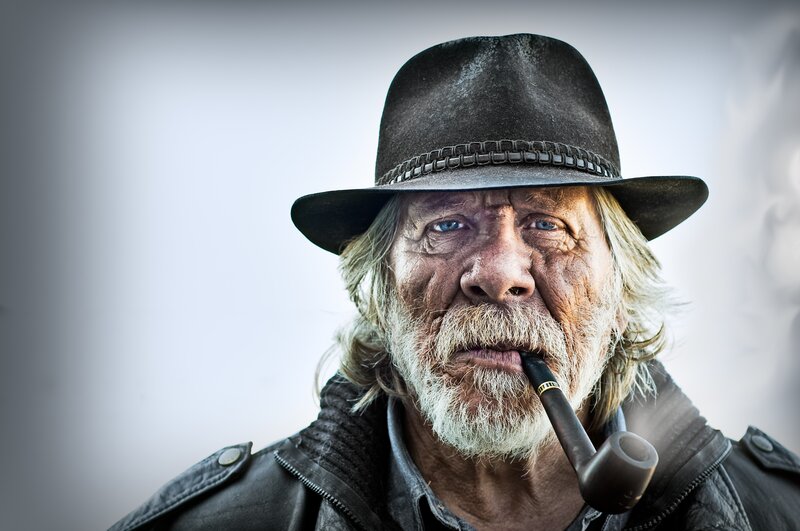 elderly man with pipe and hat