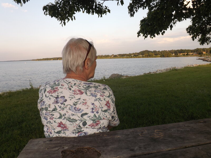 Elderly Woman at Lake