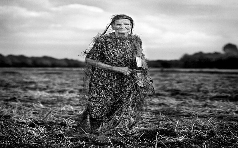 elderly woman in a field