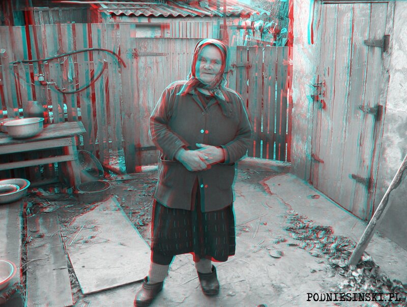 Elderly woman in rural yard
