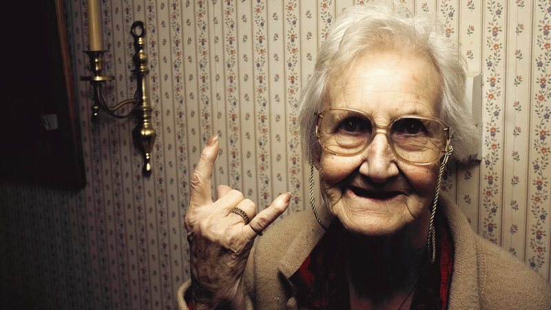 Elderly Woman Making Hand Gesture — Beige, Playful, Photograph