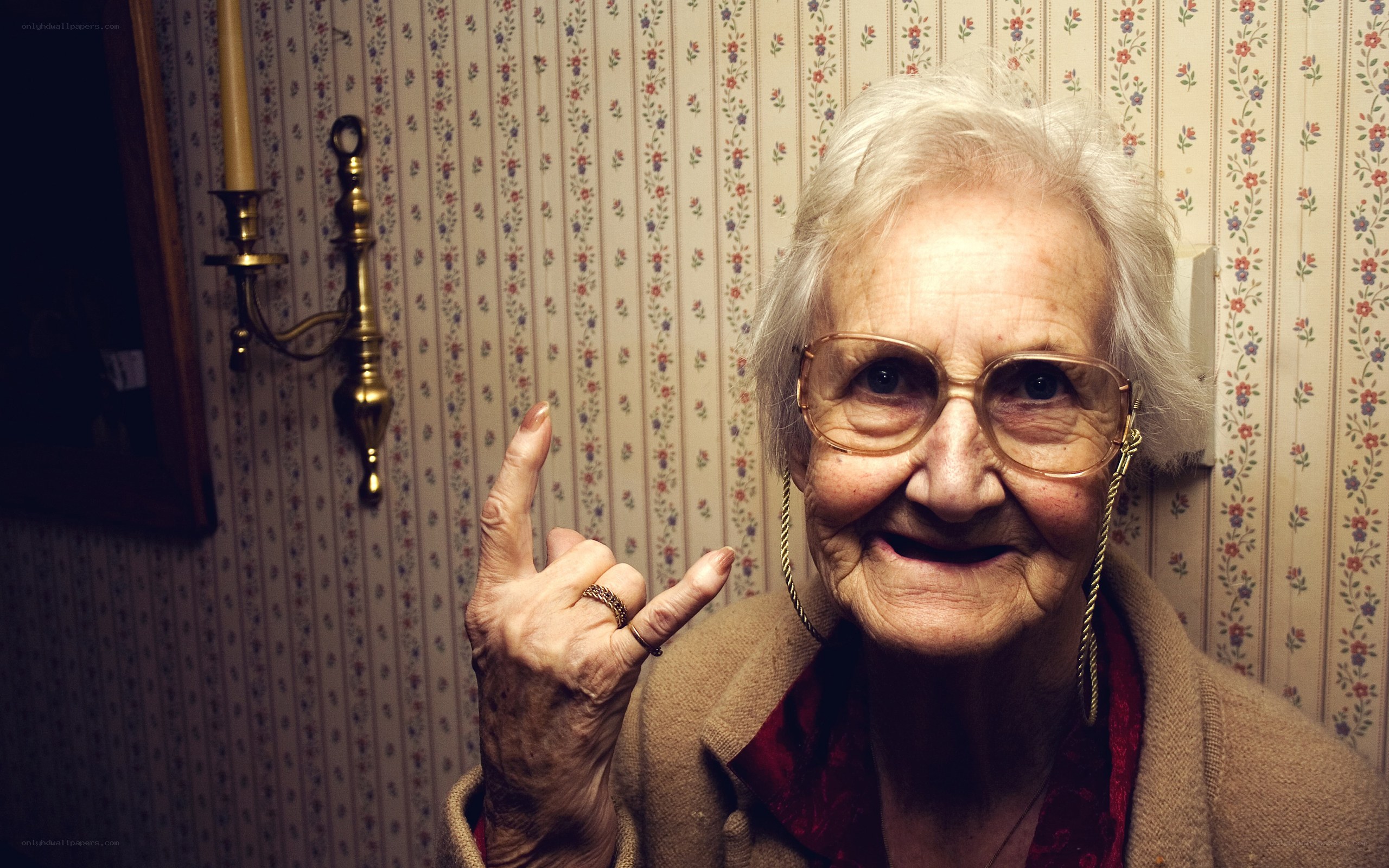 elderly woman making hand gesture