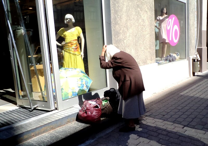 Elderly Woman on Sidewalk