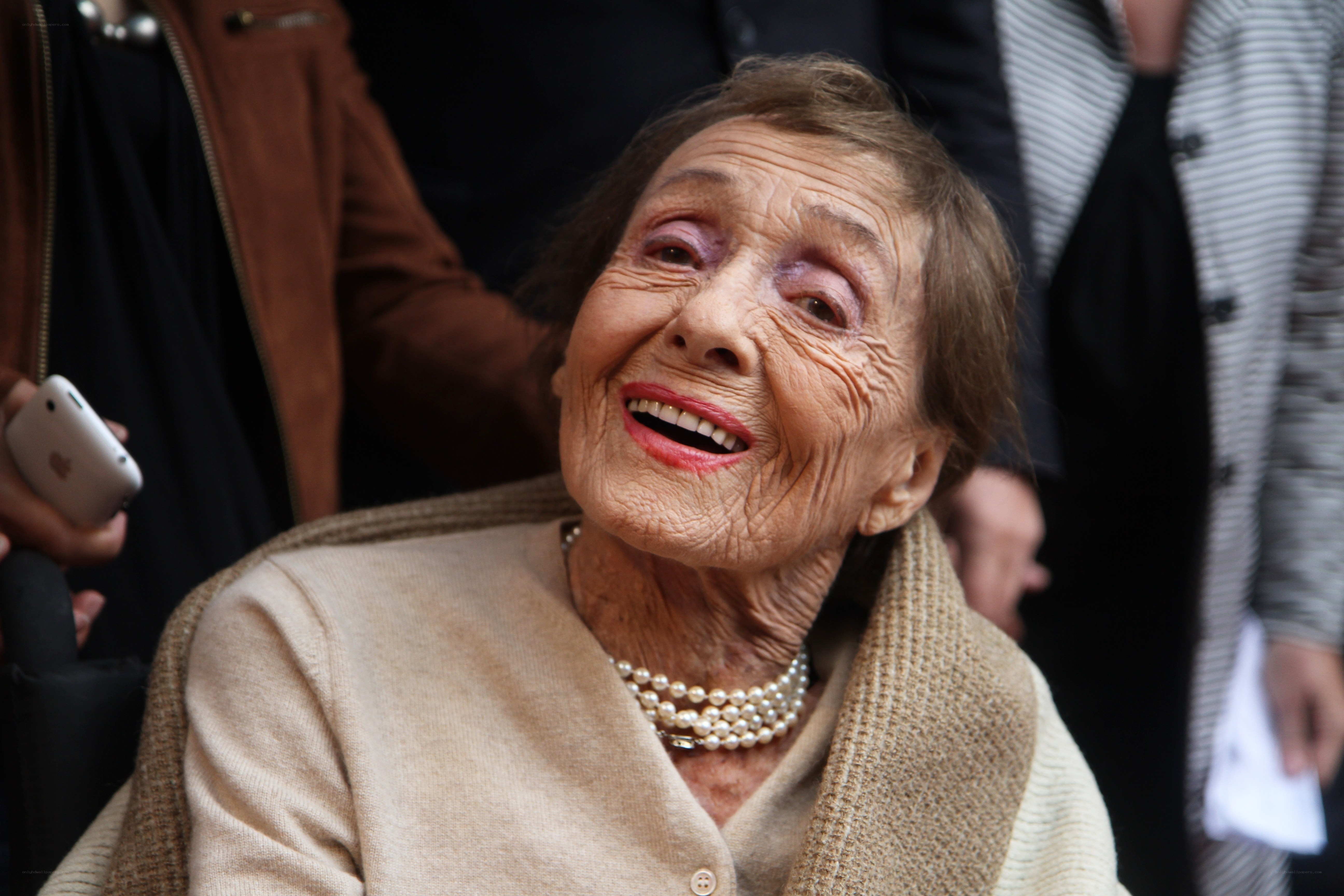 elderly woman smiling at event