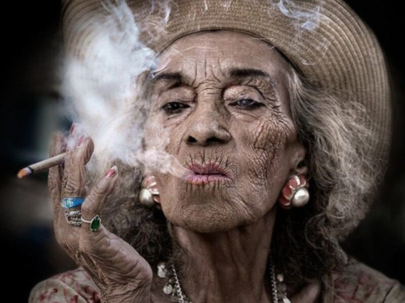 Elderly Woman Smoking — Brown