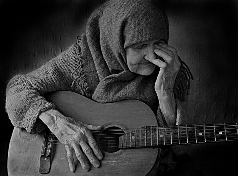 Elderly Woman with Guitar