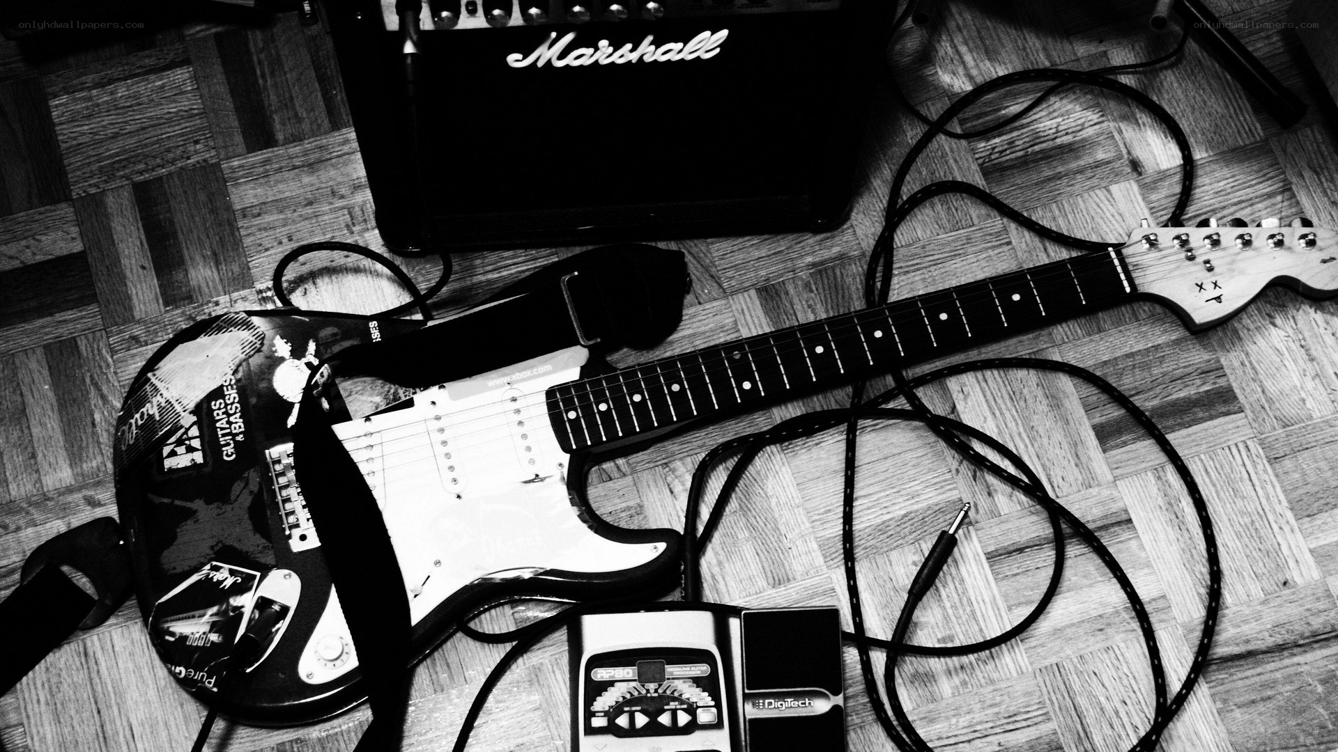 electric guitar and amp on floor