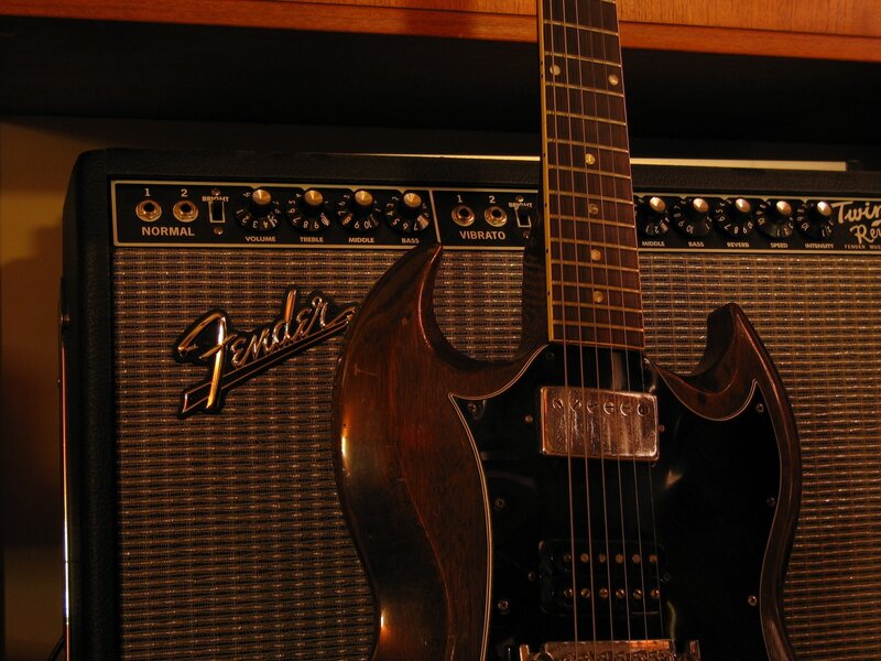 Electric Guitar and Amplifier — Brown, Dramatic, Photograph, Wooden Cabinet