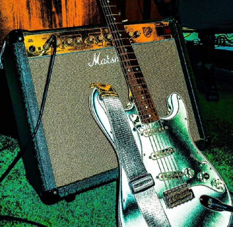 Electric Guitar on Amplifier — Green