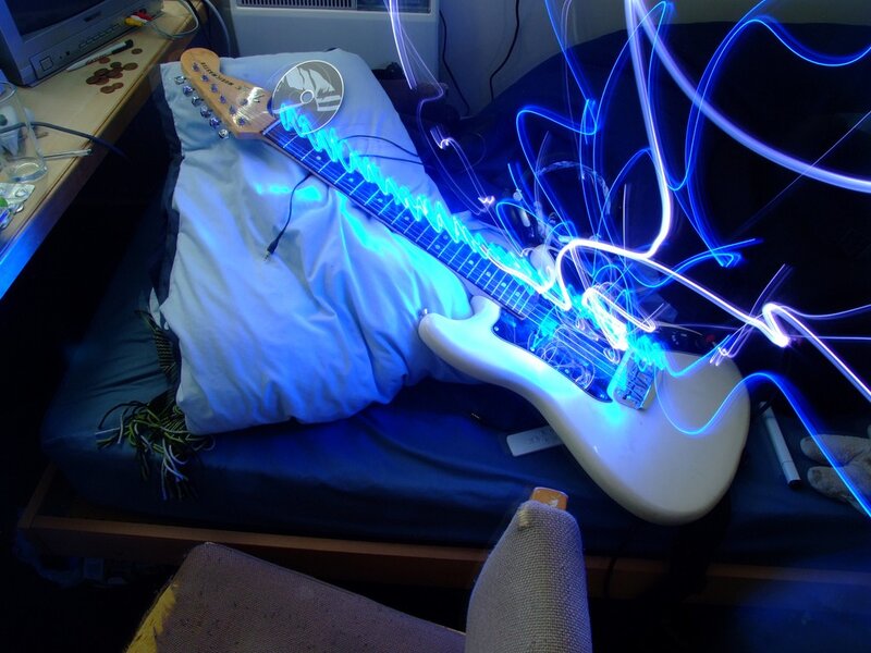 Electric Guitar on Bed