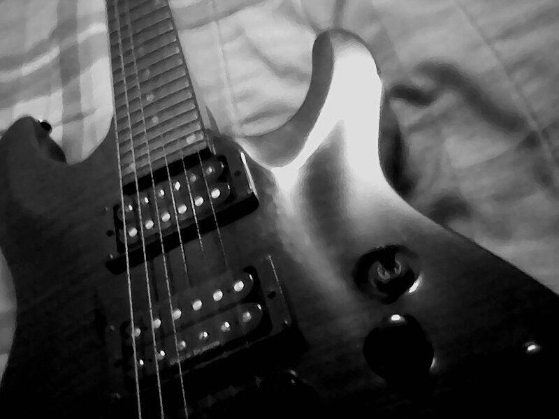 Electric Guitar on Fabric — Black, Dramatic, Photograph