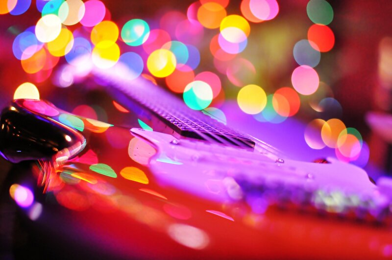 Electric Guitar on Stage — Purple